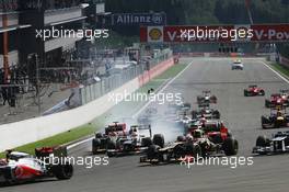 A crash at the start of the race involving Lewis Hamilton (GBR) McLaren MP4/27 and Romain Grosjean (FRA) Lotus F1 E20. 02.09.2012. Formula 1 World Championship, Rd 12, Belgian Grand Prix, Spa Francorchamps, Belgium, Race Day