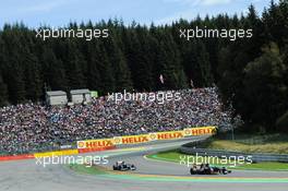 Jean-Eric Vergne (FRA) Scuderia Toro Rosso STR7 leads Bruno Senna (BRA) Williams FW34. 02.09.2012. Formula 1 World Championship, Rd 12, Belgian Grand Prix, Spa Francorchamps, Belgium, Race Day