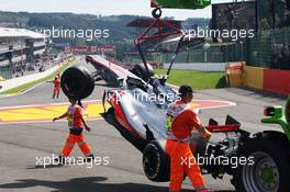 The McLaren MP4/27 of Lewis Hamilton (GBR) McLaren is craned away after a crash at the start of the race. 02.09.2012. Formula 1 World Championship, Rd 12, Belgian Grand Prix, Spa Francorchamps, Belgium, Race Day