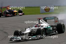 Michael Schumacher (GER), Mercedes GP and Sebastian Vettel (GER), Red Bull Racing  02.09.2012. Formula 1 World Championship, Rd 12, Belgian Grand Prix, Spa Francorchamps, Belgium, Race Day