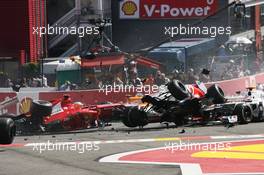 A crash at the start of the race involving Lewis Hamilton (GBR) McLaren MP4/27 and Romain Grosjean (FRA) Lotus F1 E20; Fernando Alonso (ESP) Ferrari F2012; Sergio Perez (MEX) Sauber C31 and Pastor Maldonado (VEN) Williams FW34. 02.09.2012. Formula 1 World Championship, Rd 12, Belgian Grand Prix, Spa Francorchamps, Belgium, Race Day