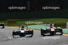 (L to R): Nico Rosberg (GER) Mercedes AMG F1 W03 and Nico Hulkenberg (GER) Sahara Force India F1 VJM05 battle for position. 02.09.2012. Formula 1 World Championship, Rd 12, Belgian Grand Prix, Spa Francorchamps, Belgium, Race Day