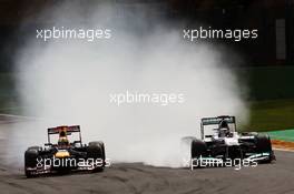(L to R): Sebastian Vettel (GER) Red Bull Racing RB8 and Michael Schumacher (GER) Mercedes AMG F1 W03 battle for position. 02.09.2012. Formula 1 World Championship, Rd 12, Belgian Grand Prix, Spa Francorchamps, Belgium, Race Day