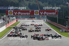 Jenson Button (GBR) McLaren MP4/27 leads at the start of the race as a crash ensues involving Lewis Hamilton (GBR) McLaren MP4/27 and Romain Grosjean (FRA) Lotus F1 E20. 02.09.2012. Formula 1 World Championship, Rd 12, Belgian Grand Prix, Spa Francorchamps, Belgium, Race Day