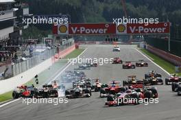 Jenson Button (GBR) McLaren MP4/27 leads at the start of the race as a crash ensues involving Lewis Hamilton (GBR) McLaren MP4/27 and Romain Grosjean (FRA) Lotus F1 E20. 02.09.2012. Formula 1 World Championship, Rd 12, Belgian Grand Prix, Spa Francorchamps, Belgium, Race Day