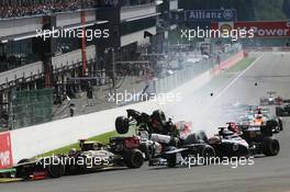 A crash at the start of the race involving Lewis Hamilton (GBR) McLaren MP4/27 and Romain Grosjean (FRA) Lotus F1 E20; Sergio Perez (MEX) Sauber C31 and Pastor Maldonado (VEN) Williams FW34. 02.09.2012. Formula 1 World Championship, Rd 12, Belgian Grand Prix, Spa Francorchamps, Belgium, Race Day