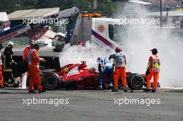 Fernando Alonso (ESP) Ferrari F2012 is helped from his car after a crash at the start of the race. 02.09.2012. Formula 1 World Championship, Rd 12, Belgian Grand Prix, Spa Francorchamps, Belgium, Race Day