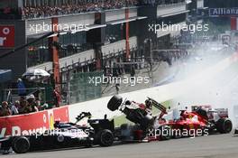 A crash at the start of the race involving Lewis Hamilton (GBR) McLaren MP4/27 and Romain Grosjean (FRA) Lotus F1 E20; Fernando Alonso (ESP) Ferrari F2012; Sergio Perez (MEX) Sauber C31 and Pastor Maldonado (VEN) Williams FW34. 02.09.2012. Formula 1 World Championship, Rd 12, Belgian Grand Prix, Spa Francorchamps, Belgium, Race Day