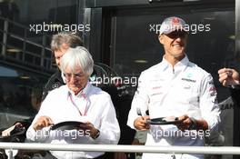 Michael Schumacher (GER) Mercedes AMG F1 celebrates his 300th GP with Bernie Ecclestone (GBR) CEO Formula One Group (FOM). 01.09.2012. Formula 1 World Championship, Rd 12, Belgian Grand Prix, Spa Francorchamps, Belgium, Qualifying Day