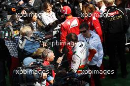 Paul di Resta (GBR) Sahara Force India F1 and Fernando Alonso (ESP) Ferrari with the media. 01.09.2012. Formula 1 World Championship, Rd 12, Belgian Grand Prix, Spa Francorchamps, Belgium, Qualifying Day