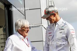 (L to R): Bernie Ecclestone (GBR) CEO Formula One Group (FOM) with Michael Schumacher (GER) Mercedes AMG F1. 01.09.2012. Formula 1 World Championship, Rd 12, Belgian Grand Prix, Spa Francorchamps, Belgium, Qualifying Day