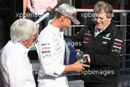 Michael Schumacher (GER) Mercedes AMG F1 celebrates his 300th GP with Bernie Ecclestone (GBR) CEO Formula One Group (FOM) and Norbert Haug (GER) Mercedes Sporting Director. 01.09.2012. Formula 1 World Championship, Rd 12, Belgian Grand Prix, Spa Francorchamps, Belgium, Qualifying Day