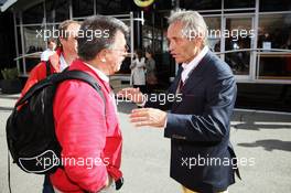 (L to R): Rainer Schlegelmilch (GER) Photograpgher with Jacky Ickx (BEL). 02.09.2012. Formula 1 World Championship, Rd 12, Belgian Grand Prix, Spa Francorchamps, Belgium, Race Day