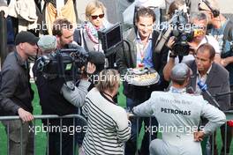 Michael Schumacher (GER), Mercedes GP gets a cake to his 300th race from RTL  02.09.2012. Formula 1 World Championship, Rd 12, Belgian Grand Prix, Spa Francorchamps, Belgium, Race Day
