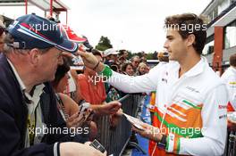 Jules Bianchi (FRA) Sahara Force India F1 Team VJM05 Third Driver signs autographs for the fans. 30.08.2012. Formula 1 World Championship, Rd 12, Belgian Grand Prix, Spa Francorchamps, Belgium, Preparation Day