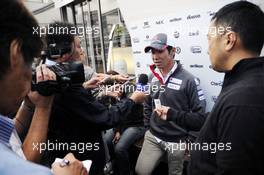 Kamui Kobayashi (JPN) Sauber with the media. 30.08.2012. Formula 1 World Championship, Rd 12, Belgian Grand Prix, Spa Francorchamps, Belgium, Preparation Day
