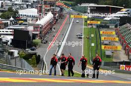 Timo Glock (GER) Marussia F1 Team (Left) walks the circuit and climbs Eau Rouge. 30.08.2012. Formula 1 World Championship, Rd 12, Belgian Grand Prix, Spa Francorchamps, Belgium, Preparation Day