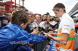 Paul di Resta (GBR) Sahara Force India F1 signs autographs for the fans. 30.08.2012. Formula 1 World Championship, Rd 12, Belgian Grand Prix, Spa Francorchamps, Belgium, Preparation Day