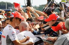 Jenson Button (GBR) McLaren signs autographs for the fans. 30.08.2012. Formula 1 World Championship, Rd 12, Belgian Grand Prix, Spa Francorchamps, Belgium, Preparation Day