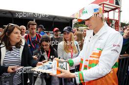 Nico Hulkenberg (GER) Sahara Force India F1 signs autographs for the fans. 30.08.2012. Formula 1 World Championship, Rd 12, Belgian Grand Prix, Spa Francorchamps, Belgium, Preparation Day