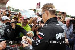 Michael Schumacher (GER) Mercedes AMG F1 signs autographs for the fans. 30.08.2012. Formula 1 World Championship, Rd 12, Belgian Grand Prix, Spa Francorchamps, Belgium, Preparation Day