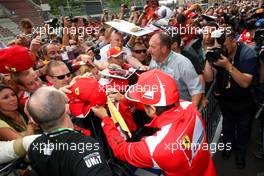 Fernando Alonso (ESP), Scuderia Ferrari signing autographs for the fans 30.08.2012. Formula 1 World Championship, Rd 12, Belgian Grand Prix, Spa Francorchamps, Belgium, Preparation Day