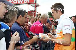 Paul di Resta (GBR) Sahara Force India F1 signs autographs for the fans. 30.08.2012. Formula 1 World Championship, Rd 12, Belgian Grand Prix, Spa Francorchamps, Belgium, Preparation Day