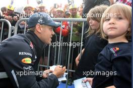 Sebastian Vettel (GER), Red Bull Racing signing autographs for the fans 30.08.2012. Formula 1 World Championship, Rd 12, Belgian Grand Prix, Spa Francorchamps, Belgium, Preparation Day