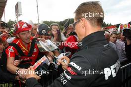 Michael Schumacher (GER), Mercedes GP  signing autographs for the fans 30.08.2012. Formula 1 World Championship, Rd 12, Belgian Grand Prix, Spa Francorchamps, Belgium, Preparation Day