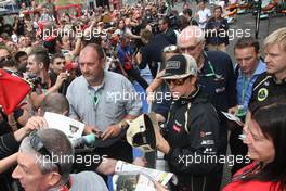 Kimi Raikkonen (FIN), Lotus F1 Team  signing autographs for the fans 30.08.2012. Formula 1 World Championship, Rd 12, Belgian Grand Prix, Spa Francorchamps, Belgium, Preparation Day
