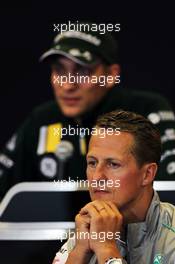 Michael Schumacher (GER) Mercedes AMG F1 and Vitaly Petrov (RUS) Caterham in the FIA Press Conference. 30.08.2012. Formula 1 World Championship, Rd 12, Belgian Grand Prix, Spa Francorchamps, Belgium, Preparation Day