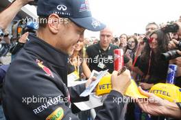 Sebastian Vettel (GER), Red Bull Racing signing autographs for the fans 30.08.2012. Formula 1 World Championship, Rd 12, Belgian Grand Prix, Spa Francorchamps, Belgium, Preparation Day