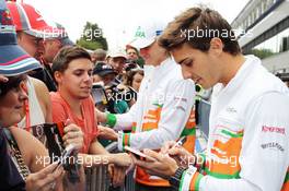 Jules Bianchi (FRA) Sahara Force India F1 Team Third Driver and Nico Hulkenberg (GER) Sahara Force India F1 sign autographs for the fans. 30.08.2012. Formula 1 World Championship, Rd 12, Belgian Grand Prix, Spa Francorchamps, Belgium, Preparation Day