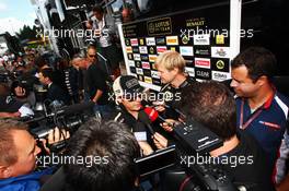 Kimi Raikkonen (FIN) Lotus F1 Team with the media. 30.08.2012. Formula 1 World Championship, Rd 12, Belgian Grand Prix, Spa Francorchamps, Belgium, Preparation Day