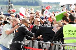 Lewis Hamilton (GBR) McLaren signs autographs for the fans. 30.08.2012. Formula 1 World Championship, Rd 12, Belgian Grand Prix, Spa Francorchamps, Belgium, Preparation Day