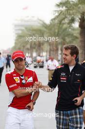 (L to R): Felipe Massa (BRA) Ferrari with Sebastian Vettel (GER) Red Bull Racing. 20.04.2012. Formula 1 World Championship, Rd 4, Bahrain Grand Prix, Sakhir, Bahrain, Practice Day