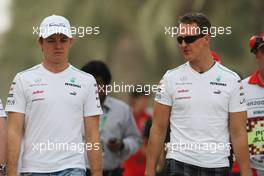 (L to R): Nico Rosberg (GER) Mercedes AMG F1 with Michael Schumacher (GER) Mercedes AMG F1. 20.04.2012. Formula 1 World Championship, Rd 4, Bahrain Grand Prix, Sakhir, Bahrain, Practice Day