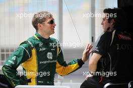 Vitaly Petrov (RUS) Caterham with a former Lotus team colleague. 20.04.2012. Formula 1 World Championship, Rd 4, Bahrain Grand Prix, Sakhir, Bahrain, Practice Day