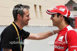 (L to R): Tiago Monteiro (POR) with Felipe Massa (BRA) Ferrari. 20.04.2012. Formula 1 World Championship, Rd 4, Bahrain Grand Prix, Sakhir, Bahrain, Practice Day