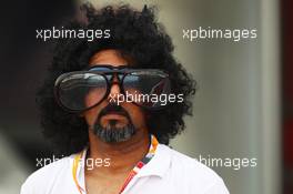 A man wearing comedy glasses in the paddock. 20.04.2012. Formula 1 World Championship, Rd 4, Bahrain Grand Prix, Sakhir, Bahrain, Practice Day