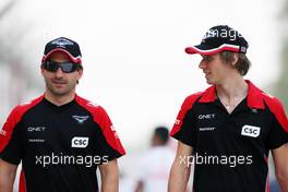 (L to R): Timo Glock (GER) Marussia F1 Team with team mate Charles Pic (FRA) Marussia F1 Team. 20.04.2012. Formula 1 World Championship, Rd 4, Bahrain Grand Prix, Sakhir, Bahrain, Practice Day