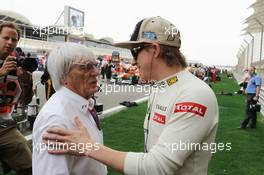 (L to R): Bernie Ecclestone (GBR) CEO Formula One Group (FOM) with Kimi Raikkonen (FIN) Lotus F1 Team on the grid. Motor Racing - Formula One World Championship - Bahrain Grand Prix - Race Day - Sakhir, Bahrain