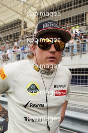 Kimi Raikkonen (FIN) Lotus F1 Team on the grid. Motor Racing - Formula One World Championship - Bahrain Grand Prix - Race Day - Sakhir, Bahrain