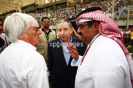 (L to R): Bernie Ecclestone (GBR) CEO Formula One Group (FOM) with Jean Todt (FRA) FIA President and Muhammed Al Khalifa (BRN) Chairman of Bahrain Circuit on the grid. Motor Racing - Formula One World Championship - Bahrain Grand Prix - Race Day - Sakhir, Bahrain