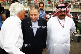 (L to R): Bernie Ecclestone (GBR) CEO Formula One Group (FOM) with Jean Todt (FRA) FIA President and Muhammed Al Khalifa (BRN) Chairman of Bahrain Circuit on the grid. Motor Racing - Formula One World Championship - Bahrain Grand Prix - Race Day - Sakhir, Bahrain