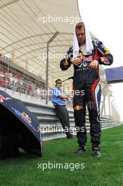 Sebastian Vettel (GER) Red Bull Racing on the grid. Motor Racing - Formula One World Championship - Bahrain Grand Prix - Race Day - Sakhir, Bahrain