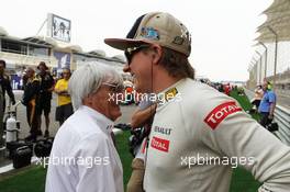 (L to R): Bernie Ecclestone (GBR) CEO Formula One Group (FOM) with Kimi Raikkonen (FIN) Lotus F1 Team on the grid. Motor Racing - Formula One World Championship - Bahrain Grand Prix - Race Day - Sakhir, Bahrain