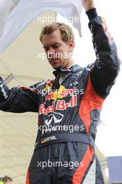 Sebastian Vettel (GER) Red Bull Racing on the grid. Motor Racing - Formula One World Championship - Bahrain Grand Prix - Race Day - Sakhir, Bahrain