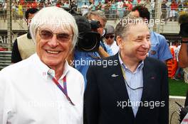 (L to R): Bernie Ecclestone (GBR) CEO Formula One Group (FOM) with Jean Todt (FRA) FIA President on the grid. Motor Racing - Formula One World Championship - Bahrain Grand Prix - Race Day - Sakhir, Bahrain