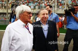 (L to R): Bernie Ecclestone (GBR) CEO Formula One Group (FOM) with Jean Todt (FRA) FIA President on the grid. Motor Racing - Formula One World Championship - Bahrain Grand Prix - Race Day - Sakhir, Bahrain